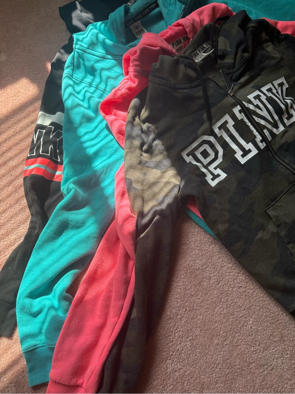 4 Pink brand zip up hoodies. Black, blue, pink and camo all in good shape - Picture 2 of 4